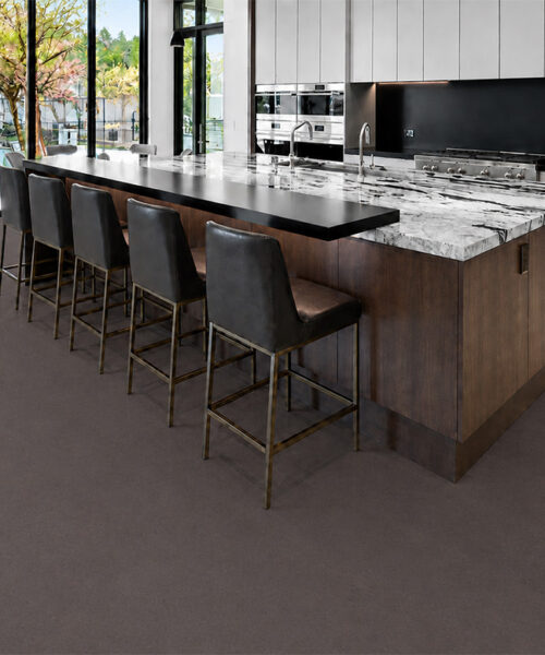 Night - 7/16" (11mm) - Swiss Real Cork Floating (FNig11) Night floating cork flooring adds deep charcoal tones to a modern kitchen with a marble island.