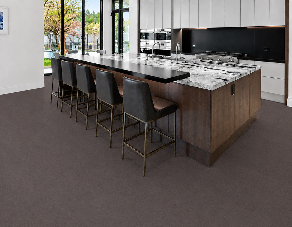 Night - 7/16" (11mm) - Swiss Real Cork Floating (FNig11) Night floating cork flooring adds deep charcoal tones to a modern kitchen with a marble island.