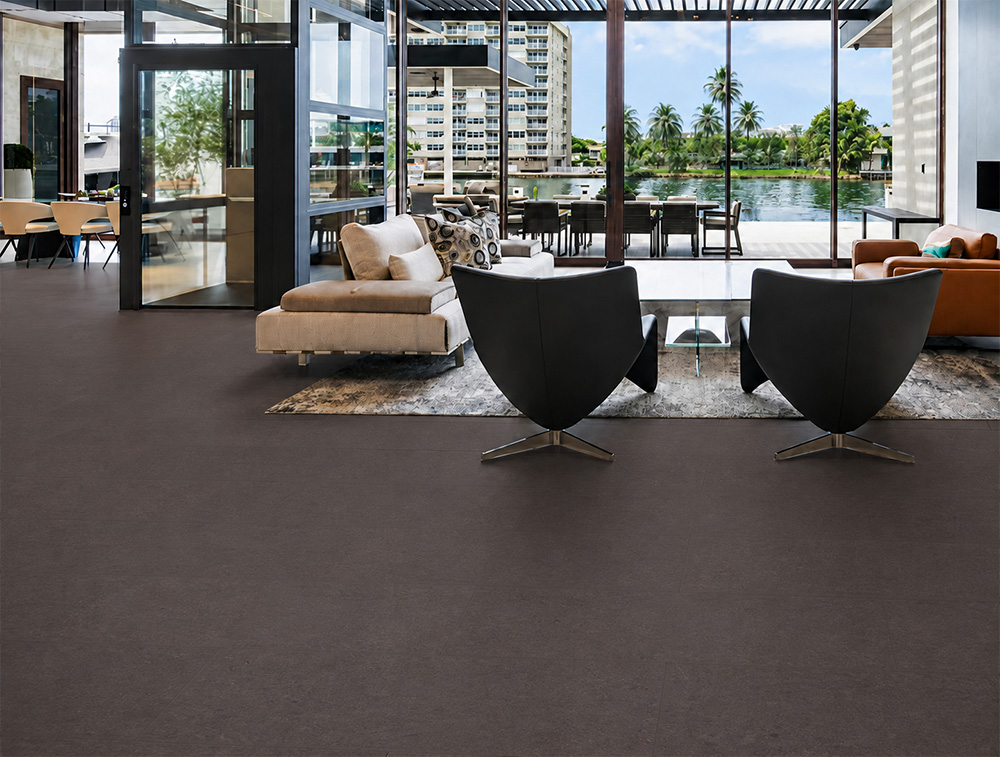 Night - 7/16" (11mm) - Swiss Real Cork Floating (FNig11) Night eco-friendly cork flooring extends across a waterfront lounge with modern seating and expansive glass walls.