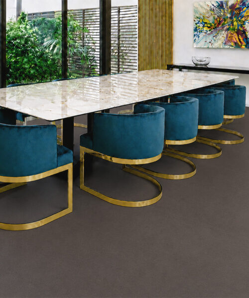 Night - 7/16" (11mm) - Swiss Real Cork Floating (FNig11) Night Swiss cork floor planks continue through a modern foyer with wooden stairs and glass doors.