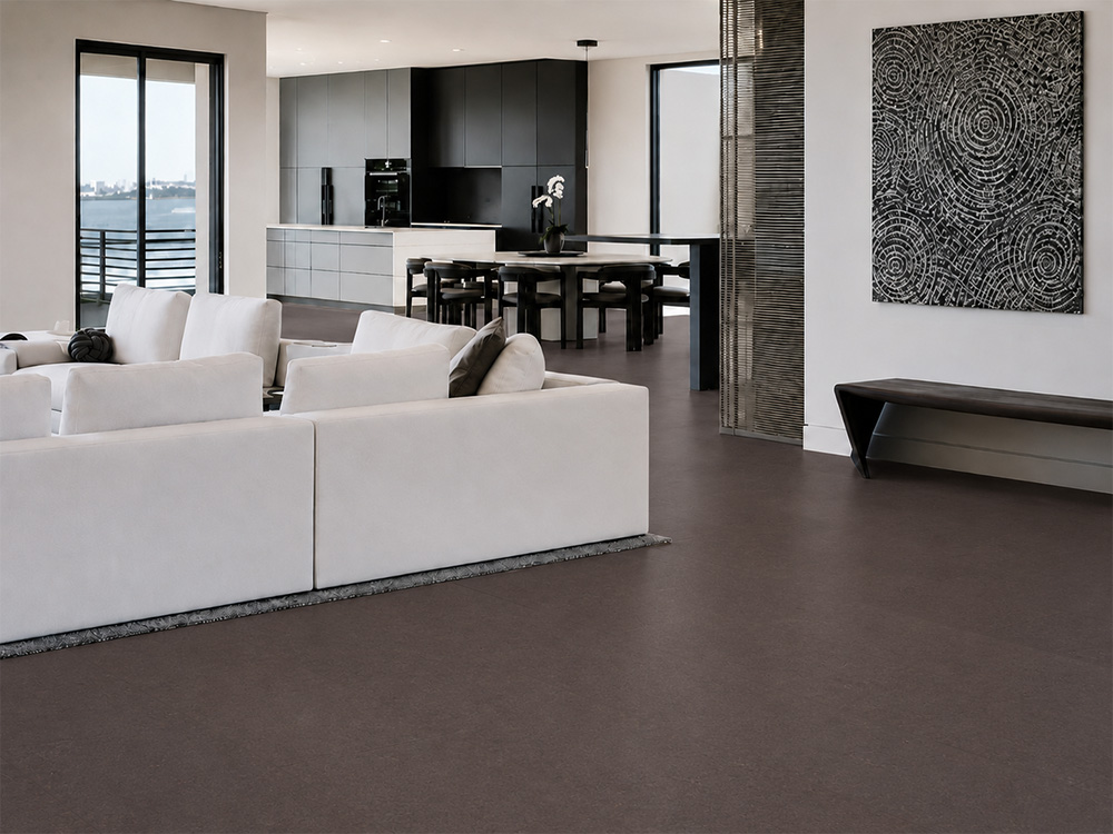 Night - 7/16" (11mm) - Swiss Real Cork Floating (FNig11) Night natural cork flooring connects a contemporary living room, dining area, and kitchen in an open layout.