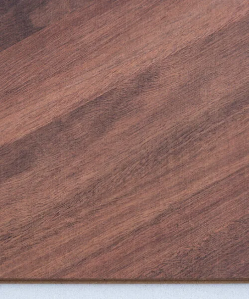 Noble Chevron Swiss Design Cork Floating Flooring featuring a rich walnut wood look in a classic European chevron pattern, combining luxury design with the comfort of cork flooring.