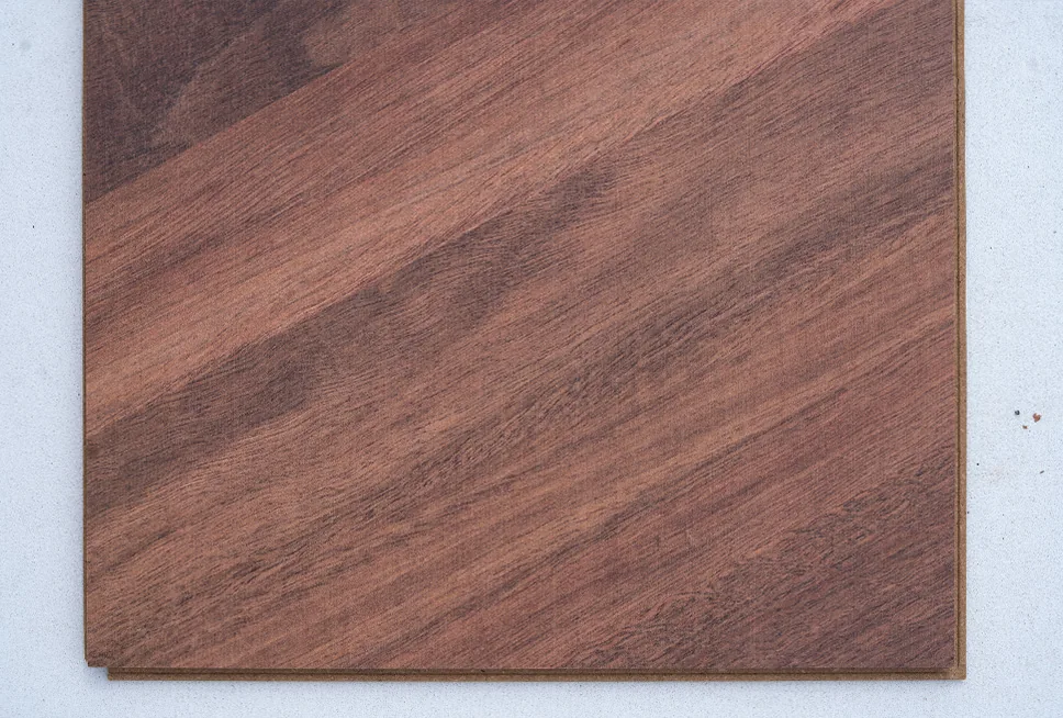 Noble Chevron - 7/16″ (11mm) - Swiss Design Cork Floating (FNob11) Noble Chevron Swiss Design Cork Floating Flooring featuring a rich walnut wood look in a classic European chevron pattern, combining luxury design with the comfort of cork flooring.