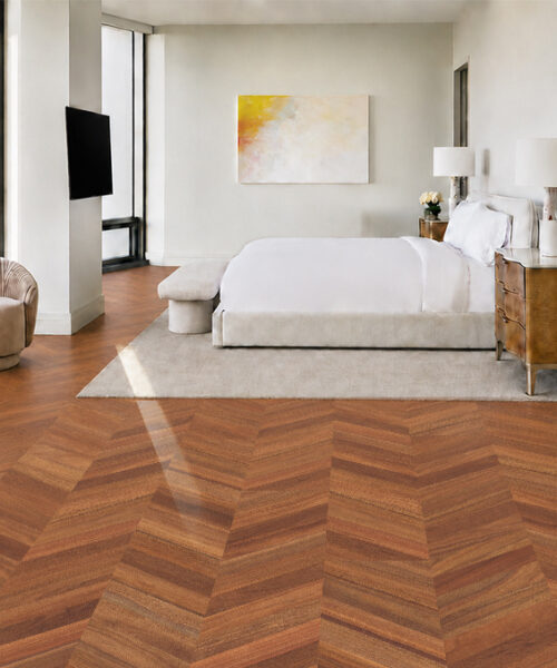 Noble Chevron eco-friendly cork flooring contrasts with white bedroom furniture and soft neutral lounge chairs.