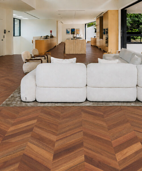 Noble Chevron Swiss Design Cork Floating Flooring surrounds white sectional seating in a spacious open-concept interior.