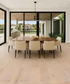 Nordic Oak - 3/8" (9.5mm) - Swiss Real Linoleum Hydrowood Core Waterproof Floating Flooring (NNorO9.5) Elegant dining space with Nordic Oak Swiss Linoleum Floating Flooring, light natural wood look planks, and expansive glass doors overlooking a modern outdoor area.