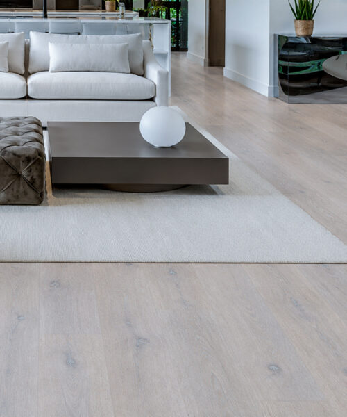 Pale Scandinavian oak floating flooring featured in a contemporary living room with subtle wood grain