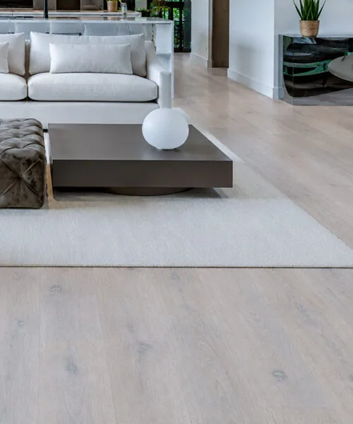 Pale Scandinavian oak floating flooring featured in a contemporary living room with subtle wood grain