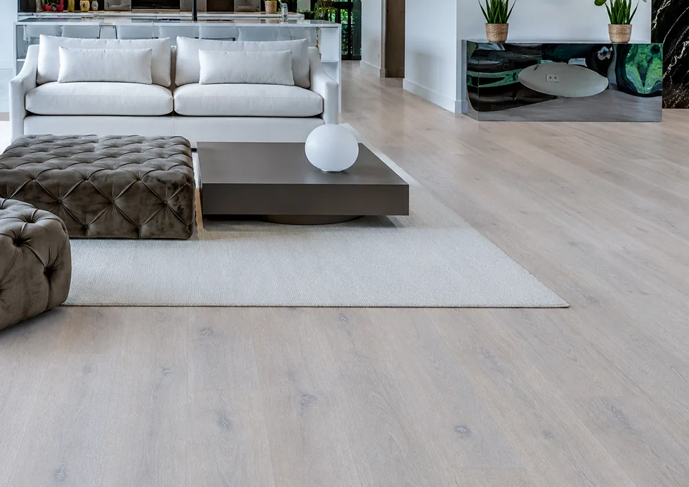 Nordic Oak - 3/8" (9.5mm) - Forna Natural Composite Flooring with Waterproof Hydrowood Core (NNorO9.5) Pale Scandinavian oak floating flooring featured in a contemporary living room with subtle wood grain