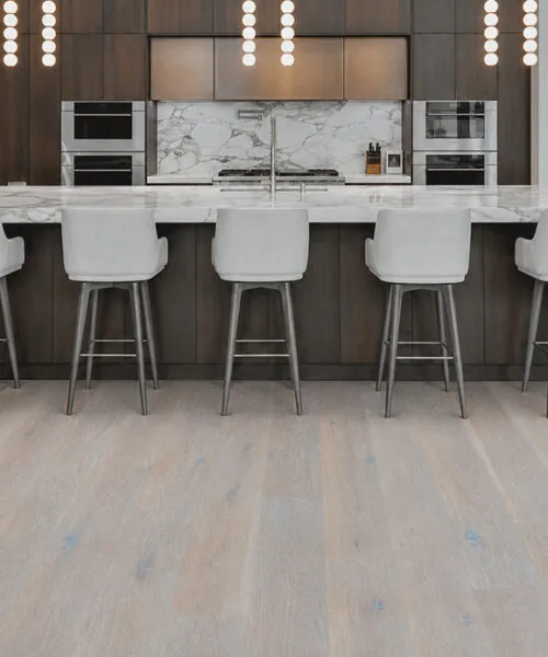 Nordic Oak - 3/8" (9.5mm) - Forna Natural Composite Flooring with Waterproof Hydrowood Core (NNorO9.5) Light oak look Forna Natural Composite flooring in an open concept kitchen with dark cabinetry