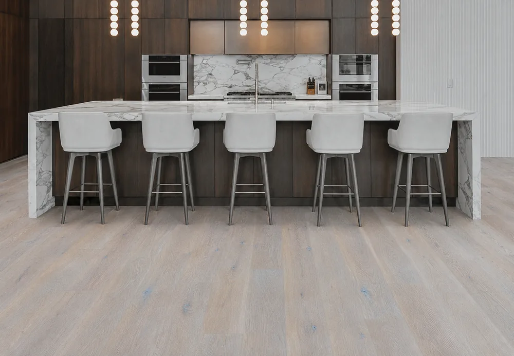 Nordic Oak - 3/8" (9.5mm) - Forna Natural Composite Flooring with Waterproof Hydrowood Core (NNorO9.5) Light oak look Forna Natural Composite flooring in an open concept kitchen with dark cabinetry