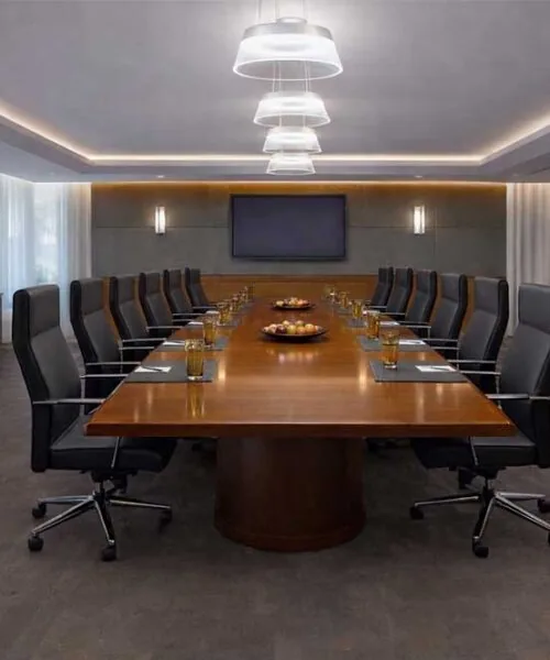 Luxury corporate boardroom with dark Onxy Swiss cork flooring, modern meeting table and elegant office lighting.