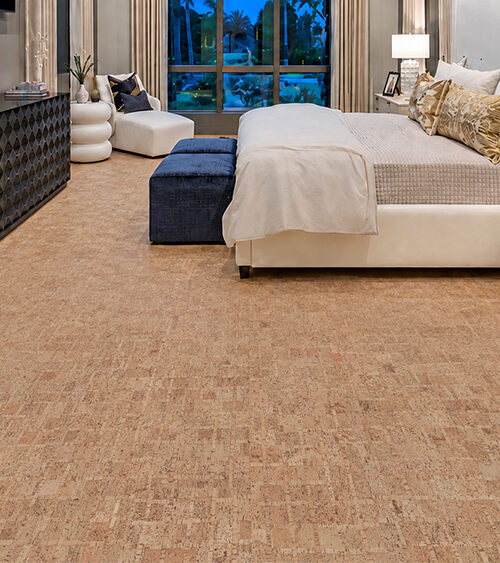 Comfortable ParCork cork flooring with a natural block texture spans a spacious modern bedroom.