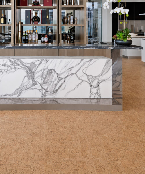 ParCork Swiss Real Cork flooring shows warm natural texture throughout a contemporary bar and kitchen.