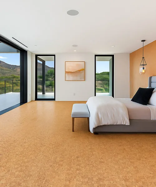 Quadro-B - 7/16” (11mm) - Swiss Real Cork Floating (FQuaB11) Peaceful master bedroom with panoramic mountain views and Quodro Swiss cork flooring, bringing softness and natural warmth underfoot.
