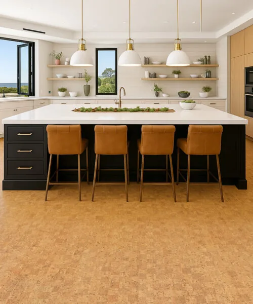 Contemporary kitchen with wood cabinetry and black island accented by Quodro Swiss cork flooring in golden beige, creating a cozy, quiet atmosphere.