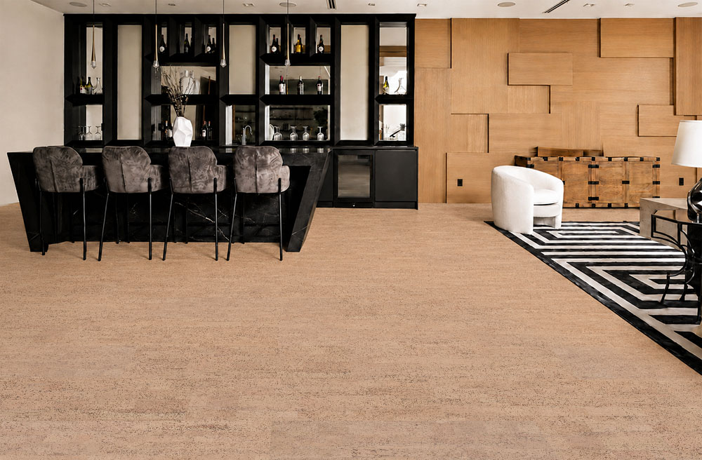 Rhythm – 7/16″ (11mm) – Swiss Real Cork Floating (FRhy11) Rhythm light beige cork floor planks cover a stylish home bar and lounge with geometric décor.