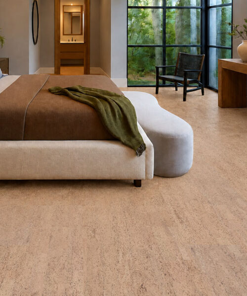 Rhythm – 7/16″ (11mm) – Swiss Real Cork Floating (FRhy11) Rhythm natural cork flooring creates a warm plank layout in a bedroom with garden-facing corner windows.