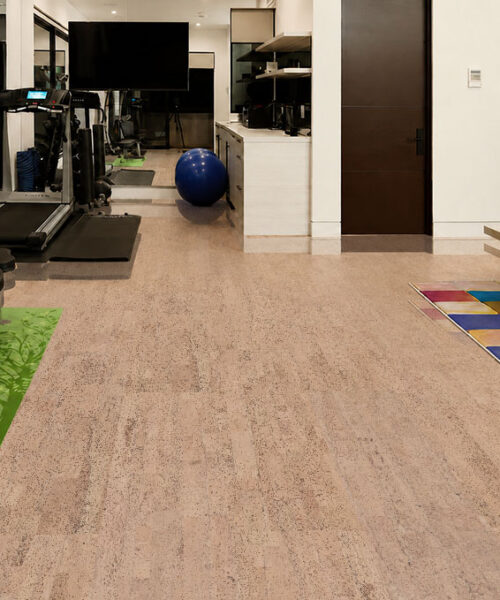 Rhythm – 7/16″ (11mm) – Swiss Real Cork Floating (FRhy11) Rhythm light natural cork flooring features subtle linear grain in a combined fitness room and sitting area.