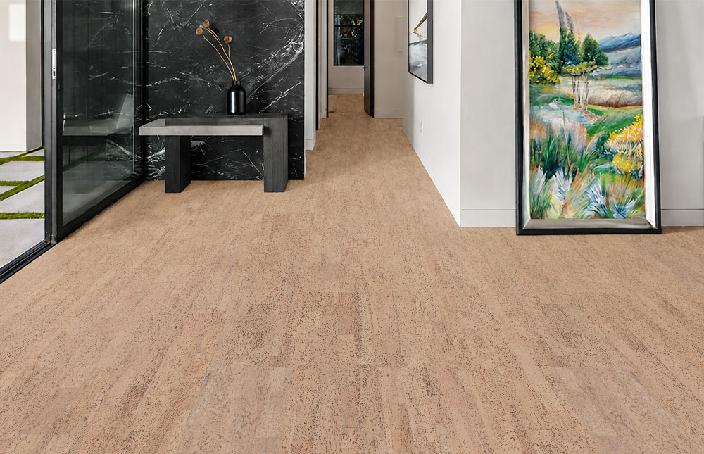 Rhythm – 7/16″ (11mm) – Swiss Real Cork Floating (FRhy11) Rhythm floating cork flooring shows fine natural texture along a modern hallway with marble and artwork.