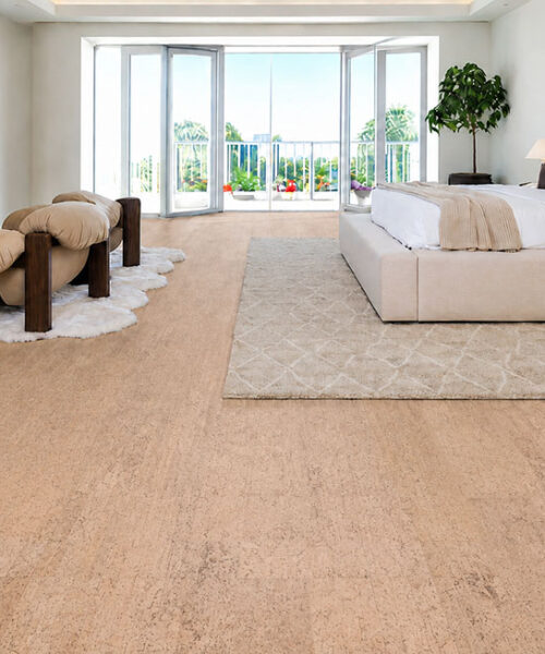 Rhythm cork flooring for a bedroom displays warm beige planks around a bed and fireplace seating.
