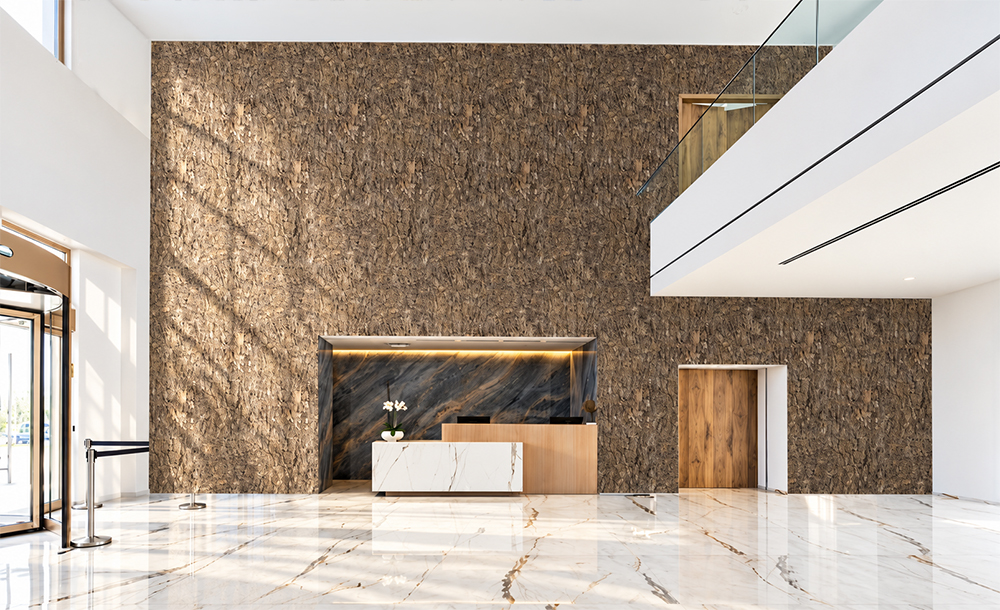 Roccia HDF - 1 7/64"(28mm) - Cork Wall Panels (WRocc28) Roccia 28mm 3D natural cork wall panels with rugged stone-like brown texture covering a tall feature wall in a modern commercial lobby with marble flooring