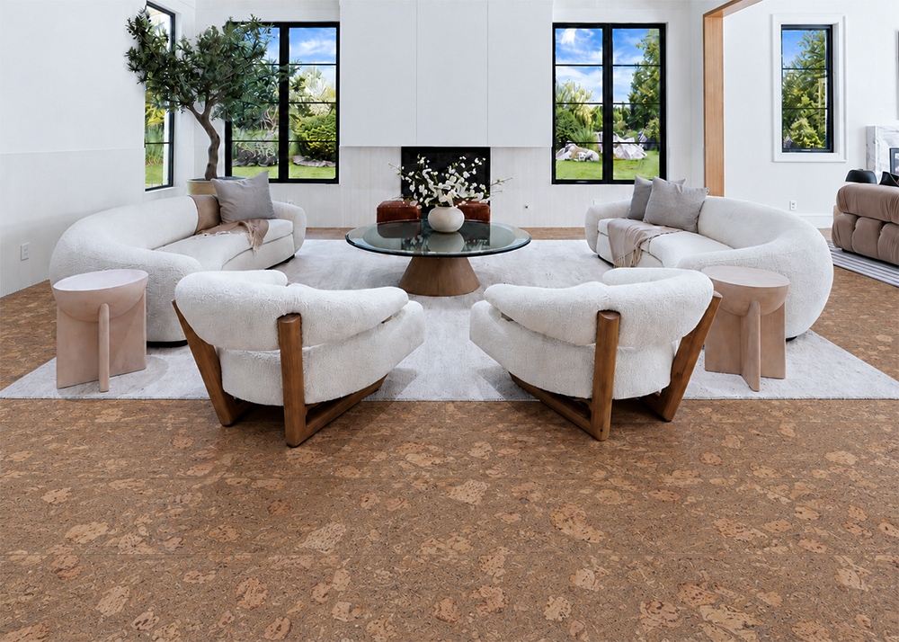 Rococo - 1/2" (12mm) - Cork Floating (FRoco12) Warm amber Rococo natural cork flooring frames rounded ivory seating and a glass coffee table.
