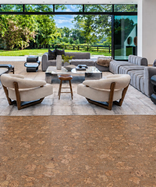 Rococo - 1/2" (12mm) - Cork Floating (FRoco12) Sustainable Rococo cork flooring in warm amber spans an open living room overlooking a green garden.