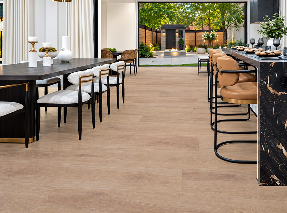 Sandstorm - 7/16" (11mm) - Swiss Design Cork Floating (FSan11) Sandstorm cream-tan hardwood-look cork flooring connects a contemporary dining area and marble home bar overlooking a landscaped courtyard.