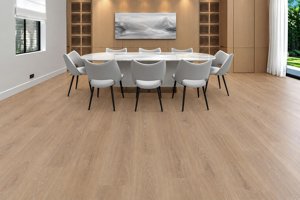 Sandstorm - 7/16" (11mm) - Swiss Design Cork Floating (FSan11) Comfortable Sandstorm light-beige cork floor in a formal dining room with a marble table, white chairs, wood cabinetry, and abstract artwork.