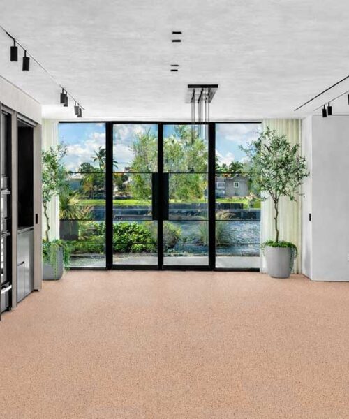 Seaside - 7/16" (11mm) - Swiss Real Cork Floating (FSea11) Spacious contemporary kitchen and living area with Seaside cork flooring, showcasing durability and natural texture.