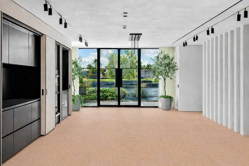 Seaside - 7/16" (11mm) - Swiss Real Cork Floating (FSea11) Spacious contemporary kitchen and living area with Seaside cork flooring, showcasing durability and natural texture.
