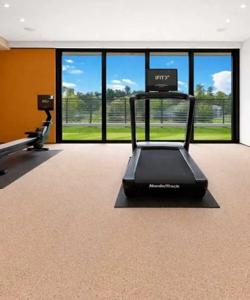 Seaside - 7/16" (11mm) - Swiss Real Cork Floating (FSea11) Seaside cork flooring installed in a home gym, providing resilient surface, sound absorption, and workout comfort.