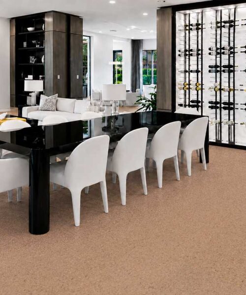 Seaside light cork floor planks create a warm foundation beneath a contemporary dining table and chairs.