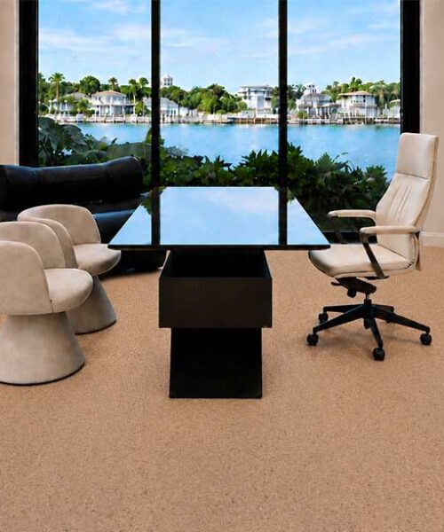 Sustainable Seaside Swiss Real Cork flooring complements a waterfront office with built-in shelving and panoramic windows.
