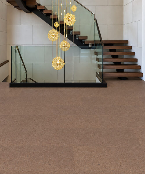 Shoreline - 25/64" (10mm) - Cork Floating (FShol10) Shoreline 10mm natural mid-brown cork floor planks with delicate speckling cover a glass-railed stair landing.