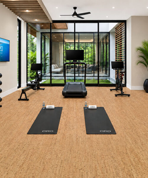 Silver Birch - 5/16" (8mm) - Cork Glue Down Tile (GSB8) Silver Birch golden ribbon cork floor planks cover a modern home gym with weights and yoga mats.