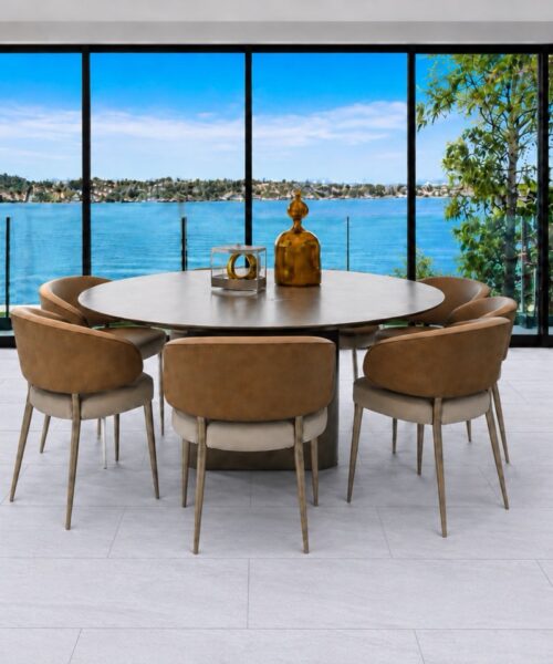 Snowstone sustainable flooring in a pale gray mineral pattern fills a modern dining area overlooking a blue waterfront.