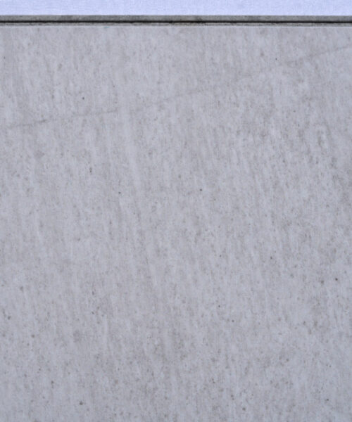 Snowstone Swiss Techslate floating flooring featuring a white limestone stone look with soft grey undertones and subtle natural mineral texture