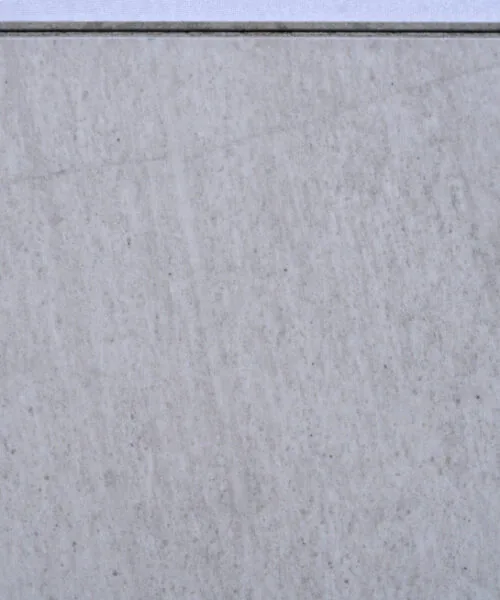 Snowstone Swiss Techslate floating flooring featuring a white limestone stone look with soft grey undertones and subtle natural mineral texture