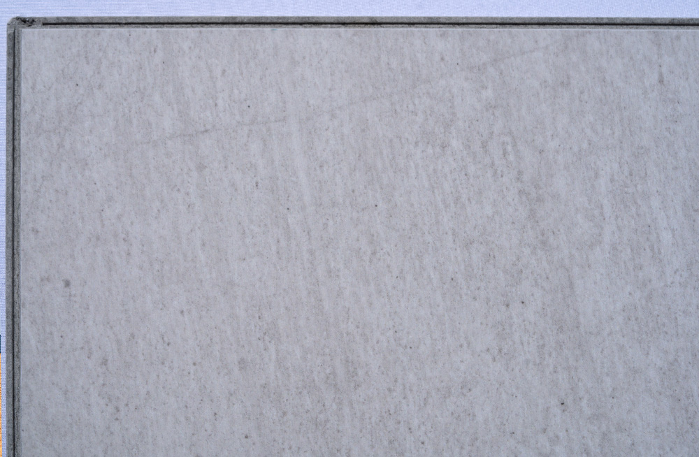 Snowstone - 19/64" (7.5mm) - Swiss Techslate (MCSnows7.5) Snowstone Swiss Techslate floating flooring featuring a white limestone stone look with soft grey undertones and subtle natural mineral texture