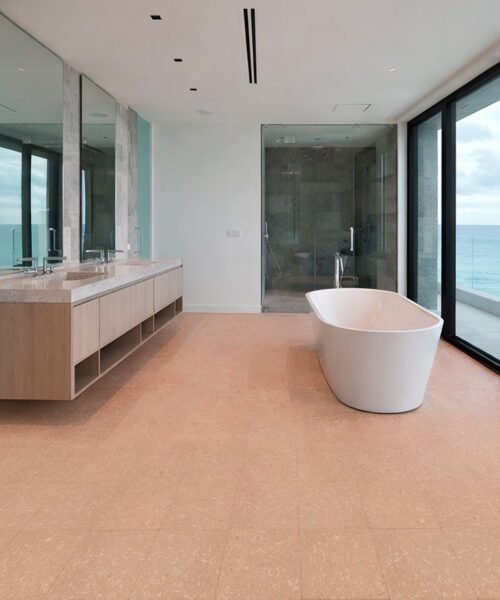 Solara solid massive glue down cork tiles in a spa-style bathroom, offering a warm, waterproof cork floor when properly sealed.