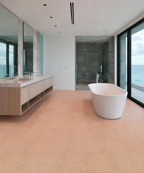 Solara solid massive glue down cork tiles in a spa-style bathroom, offering a warm, waterproof cork floor when properly sealed.
