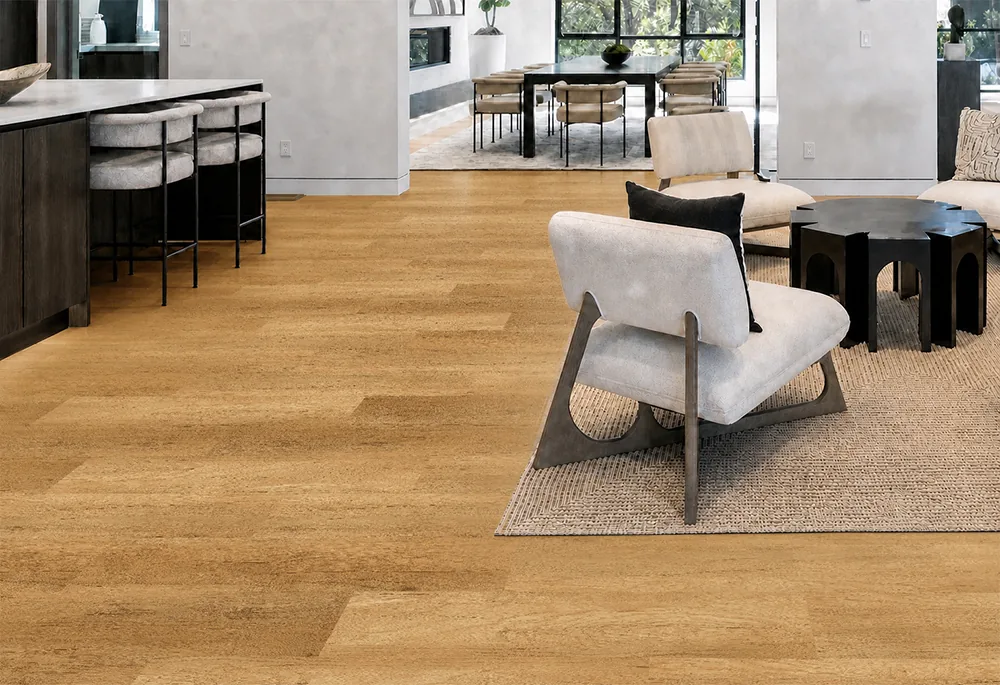 Spanish Cedar - 13/32" (10.5mm) - Design Cork Floating (FSC10.5) Spanish Cedar golden-tan cork plank flooring connecting an open-concept living room, kitchen, and dining area.