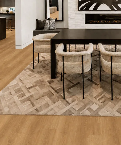 Spanish Cedar - 13/32" (10.5mm) - Design Cork Floating (FSC10.5) Spanish Cedar natural wood-grain cork flooring in an open-plan dining room with a modern fireplace.