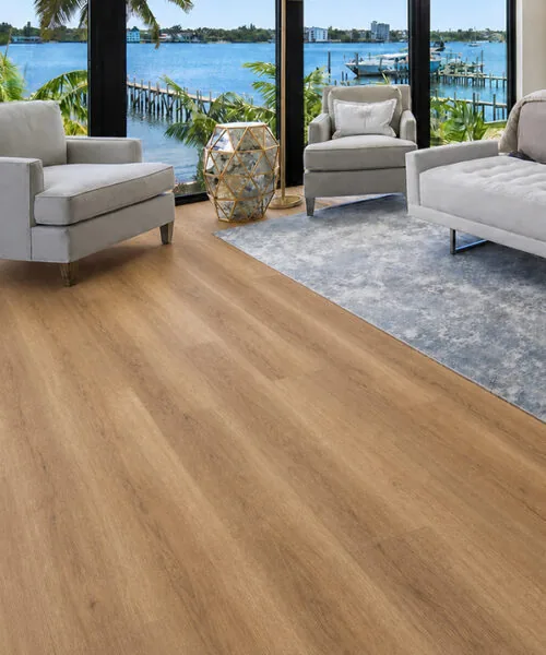 Spanish Cedar - 13/32" (10.5mm) - Design Cork Floating (FSC10.5) Spanish Cedar golden-brown cork floating flooring with a natural wood-grain pattern in an ocean-view dining room