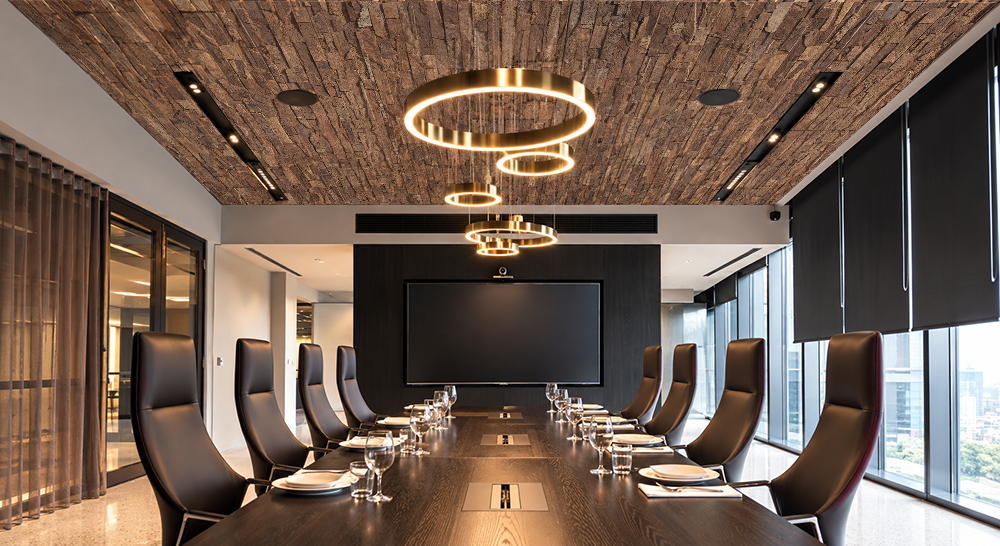 Stacked Stone - 55/64" (22mm) - Acoustic Cork Wall Tile (WSkSt22) Rich brown cork ceiling tiles with dimensional stacked stone patterns bring natural texture to a contemporary corporate boardroom.