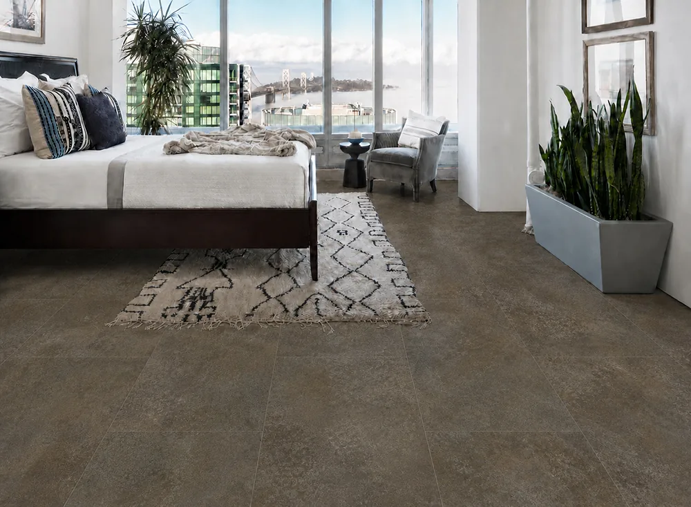 Sunlit Stone - 19/64" (7.5mm) - Swiss Techslate (MSunSt7.5) Contemporary bedroom featuring Sunlit Stone Swiss Techslate floor with a textured taupe stone appearance.