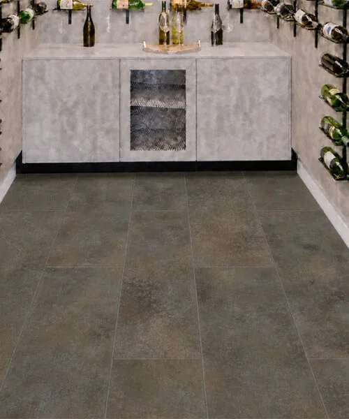 Sunlit Stone - 19/64" (7.5mm) - Swiss Techslate (MSunSt7.5) Wine cellar with waterproof Sunlit Stone Techslate flooring in a dark brown-gray stone design.