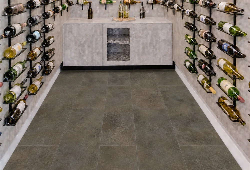 Sunlit Stone - 19/64" (7.5mm) - Swiss Techslate (MSunSt7.5) Wine cellar with waterproof Sunlit Stone Techslate flooring in a dark brown-gray stone design.